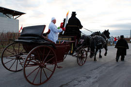 Day 52 Horse drawn carriage with Torchbearer 160 Sean Littler passes through Niagara-on-the-Lake,...
