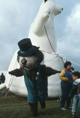 Tillicum posing in front of inflatable polar bear at Polar Bear Swim