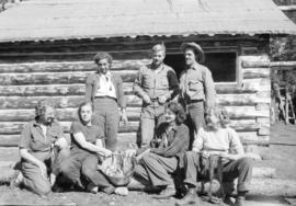 Five hikers posing with a view from the mountain