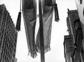 [Banners hanging from utility pole during visit of King George VI and Queen Elizabeth]