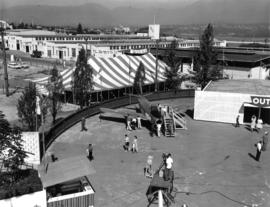 Armed Forces of Canada exhibit on P.N.E. grounds, with Livestock building in background