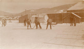 [Playing hockey in an internment camp]