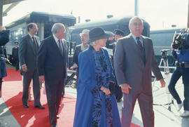 Jeanne Sauvé and Robert Gordon Rogers followed by Maurice Sauvé and Mike Harcourt exiting platfor...