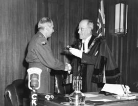 [His Worship J.W. Cornett presenting Field Marshal Montgomery with the key to the City]