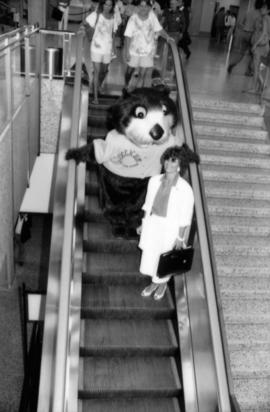 Tillicum and Sharen Smith ride an airport escalator