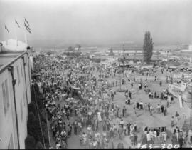 View of crowd, tents, and buildings down Walter Leek boulevard from the top of Pure Foods building