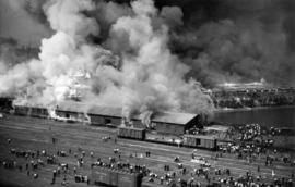 [View of crowds and fire at Canadian Pacific Railway Pier]