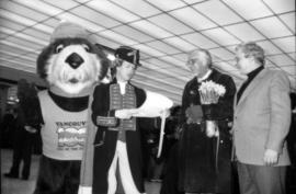 Actor dressed as Captain George Vancouver reading to Tillicum, William Hutt and unidentified man