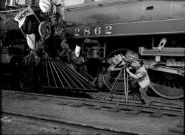 [Man filming Engine 374 during the presentation of the locomotive to the City by the CPR]