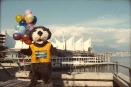 Tillicum holding balloons in front of Canada Place