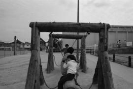 People on playground at Mid-Summer Festival at Strathcona Community Centre