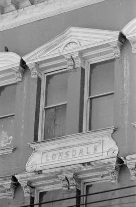 [Detail view of upper window and pediment at 8-28 West Cordova Street - Army and Navy Department ...