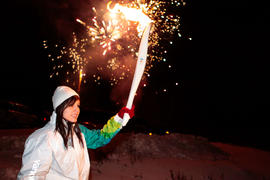 Day 67 Torchbearer 48 Melissa White carries the flame in Wauzhushk Onigum, Ontario.