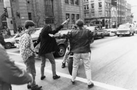 International Women's Day march, Vancouver : parade marshal tells motorcyclist to back off after ...