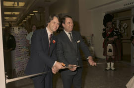 Gordon Campbell and unidentified man cutting ribbon at Legacies Program event at The Bay