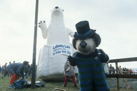 Tillicum posing in front of inflatable polar bear at Polar Bear Swim