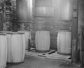 Barrels sitting under steam machine