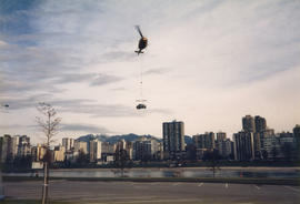 Helicopter delivering the Make Vancouver Sparkle Ford Taurus prize to Vanier Park