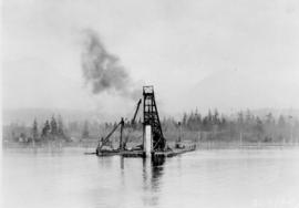 Pile driver putting in pier : February 25, 1924