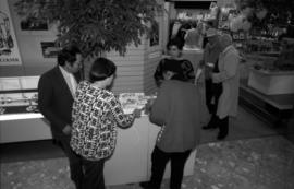 Serving cake during Legacies Program event at The Bay