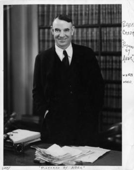 Gerald Gratton McGeer at desk