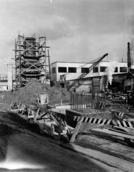 Foreground - a plinth of a pier is stripped and ready for shaft steel [bridge support construction]