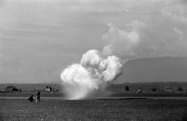 [A smoky explosion on the air field]