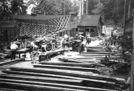 Salvaging lumber from army camp