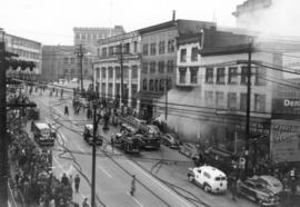 Fire engines and spectators at three alarm fire at Park Hotel