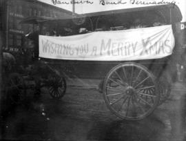 Vancouver [Salvation Army] band serenading [from horse drawn carriage with Christmas banner]
