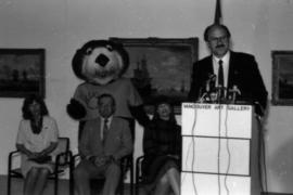 Mike Harcourt making announcement from podium at Vancouver Art Gallery