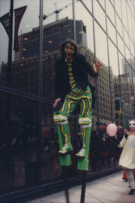 Man on stilts marching in the Beaux Gestes parade