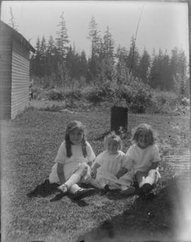 Phyllis, Muriel and Audrey sitting in yard