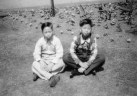 Guy Yee and the son of Leung Moo in park outside train station