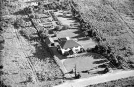 Aerial view of an unidentified estate-house and large garden on lower mainland of Vancouver