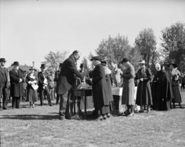 King's Jubilee Parade [Man and woman shaking hands at medal ceremony]