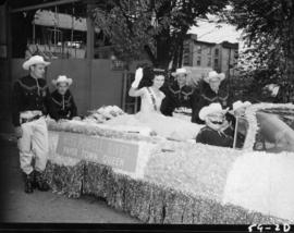 Miss Powell River on float in 1959 P.N.E. Opening Day Parade