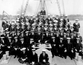 [Group portrait of Commodore Sir Charles Coke and crew on the deck of the H.M.C.S. "Stadacon...