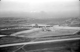 Aerial view of airport terminal, runways and approaches to Sea Island