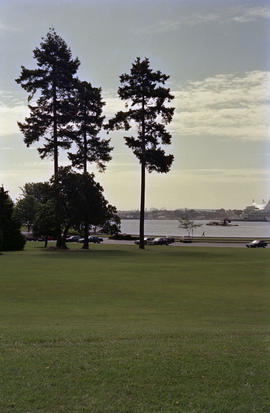 View of Stanley Park field and parking lot with Downtown Vancouver in background