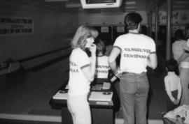 Charlotte Baynes and man wearing Vancouver Centennial t-shirts