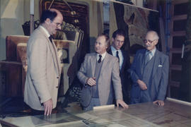 Mike Harcourt, Ferdinand Petrov, unidentified man and Fraser Wilson in front of mural