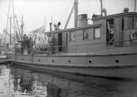 ["Caribou I" at dock flying a Victory Bonds banner]