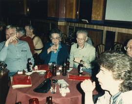 Group of unidentified people seated at a table