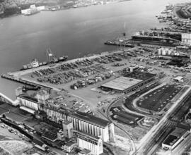 Aerial view of Pacific Terminal showing grain elevators and shipping containers in Vancouver Harbour