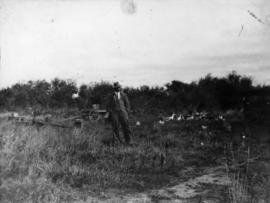 [L.D. Taylor standing in his empty lot]