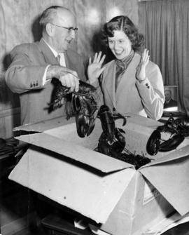 Charles E. Thompson with lady and lobsters