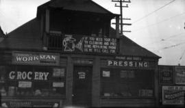 [A grocery store and Charlie Wo Merchant Tailor and cleaners in same building