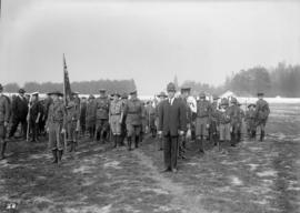 Military officers inspecting scouts