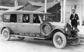 [Donald McRae beside a White Star Motor Line Limited bus]